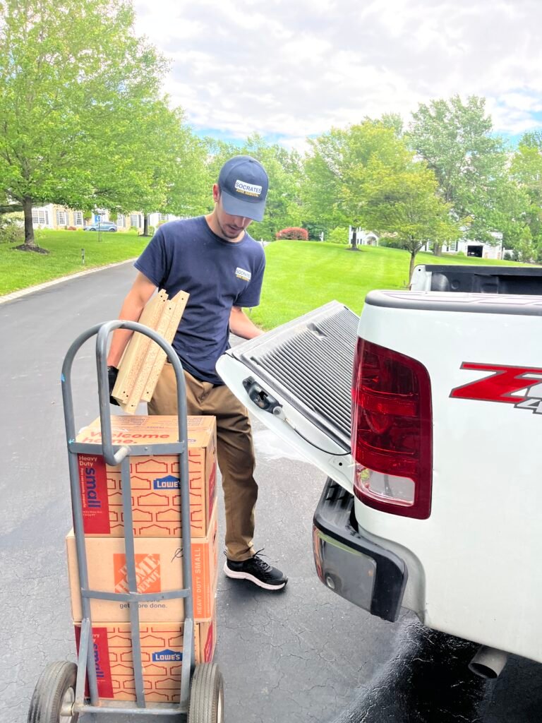 Socrates Junk Removal team member loading boxes in Wayne, PA