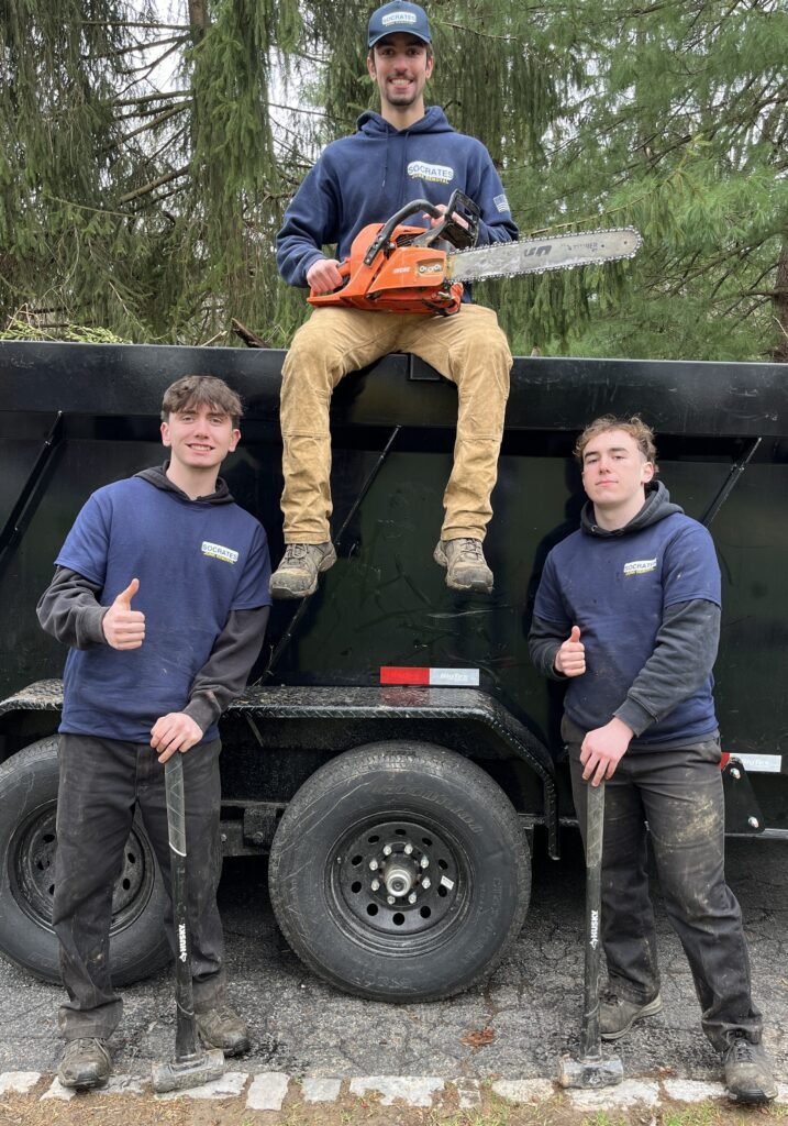 Socrates Junk Removal team with dump trailer and equipment after cleanup job