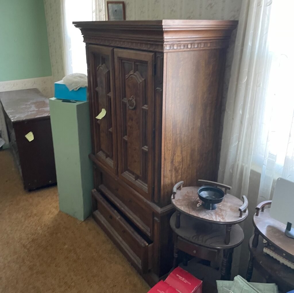 Bedroom furniture removal including wooden dresser and cabinets by Socrates Junk Removal