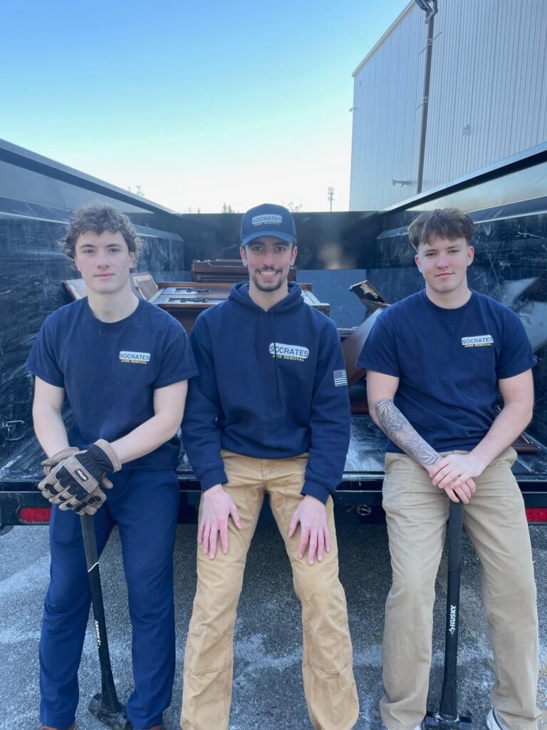 socrates junk removal crew by trailer during storage unit cleanout job
