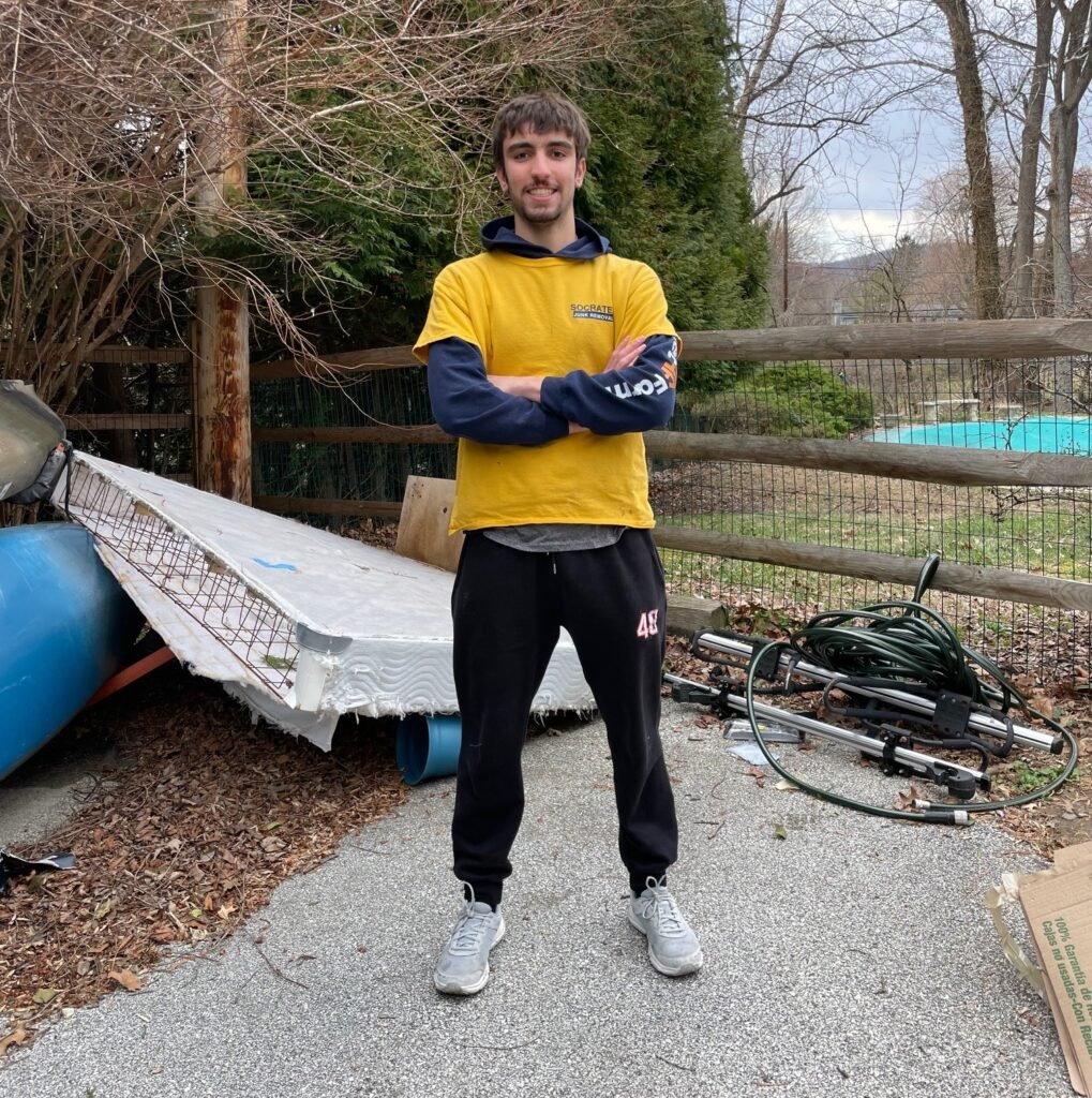 Driveway filled with junk and debris before a cleanout by Socrates Junk Removal in Wayne, PA