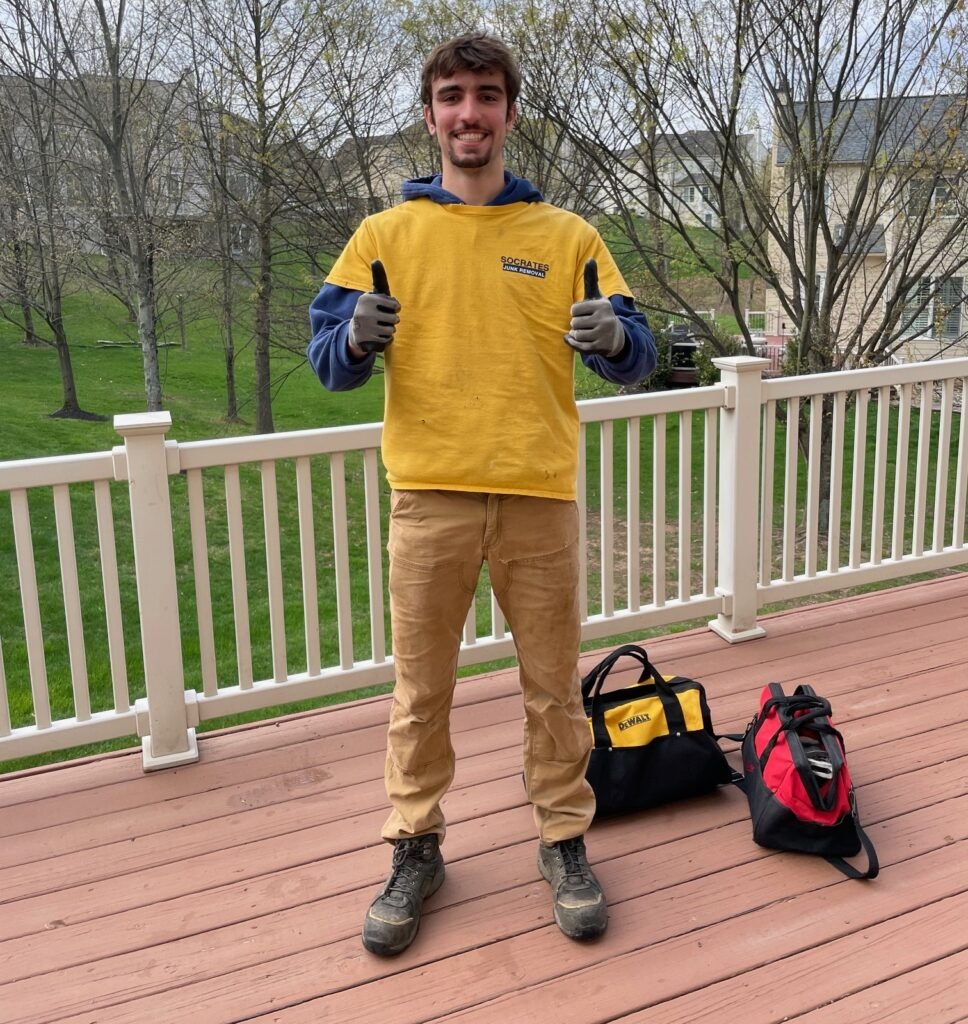 Socrates Junk Removal team member performing deck demolition in Phoenixville, PA