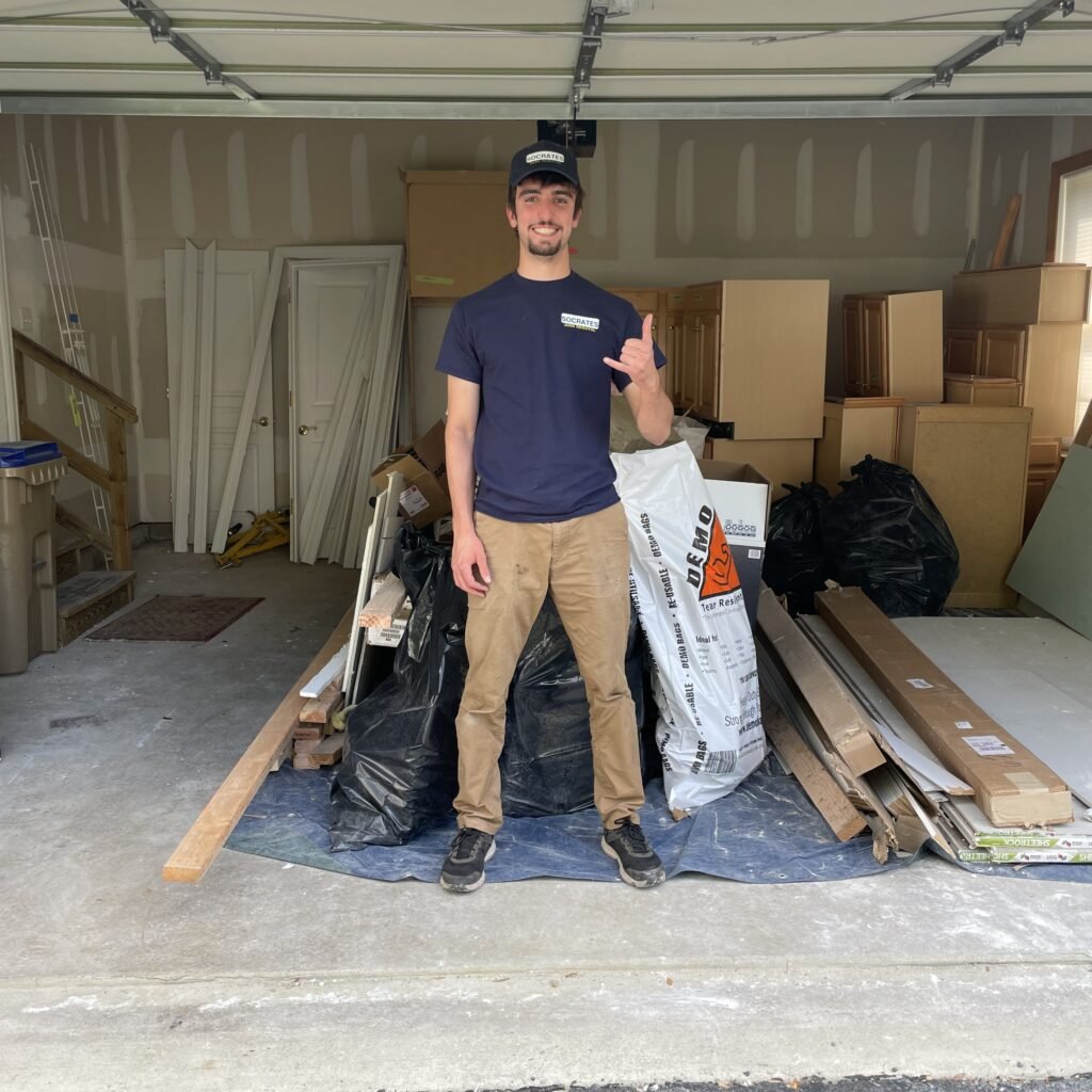 Socrates Junk Removal removing construction debris including drywall, wood, and renovation materials in Wayne
