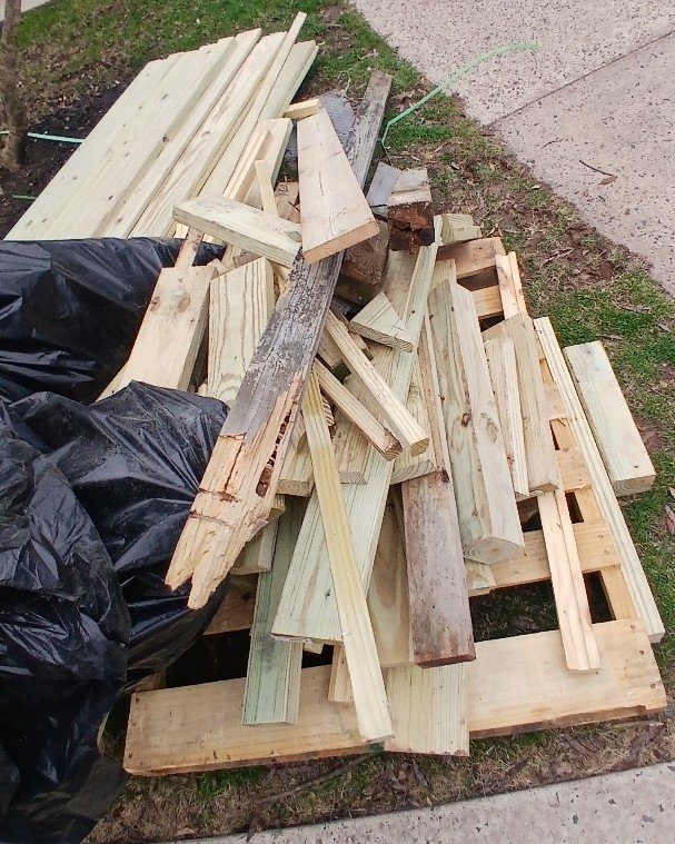 construction debris removal with wood and materials ready for hauling