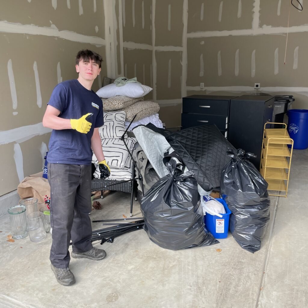 Socrates Junk Removal owner standing in front of junk removed from a Plymouth Meeting PA home
